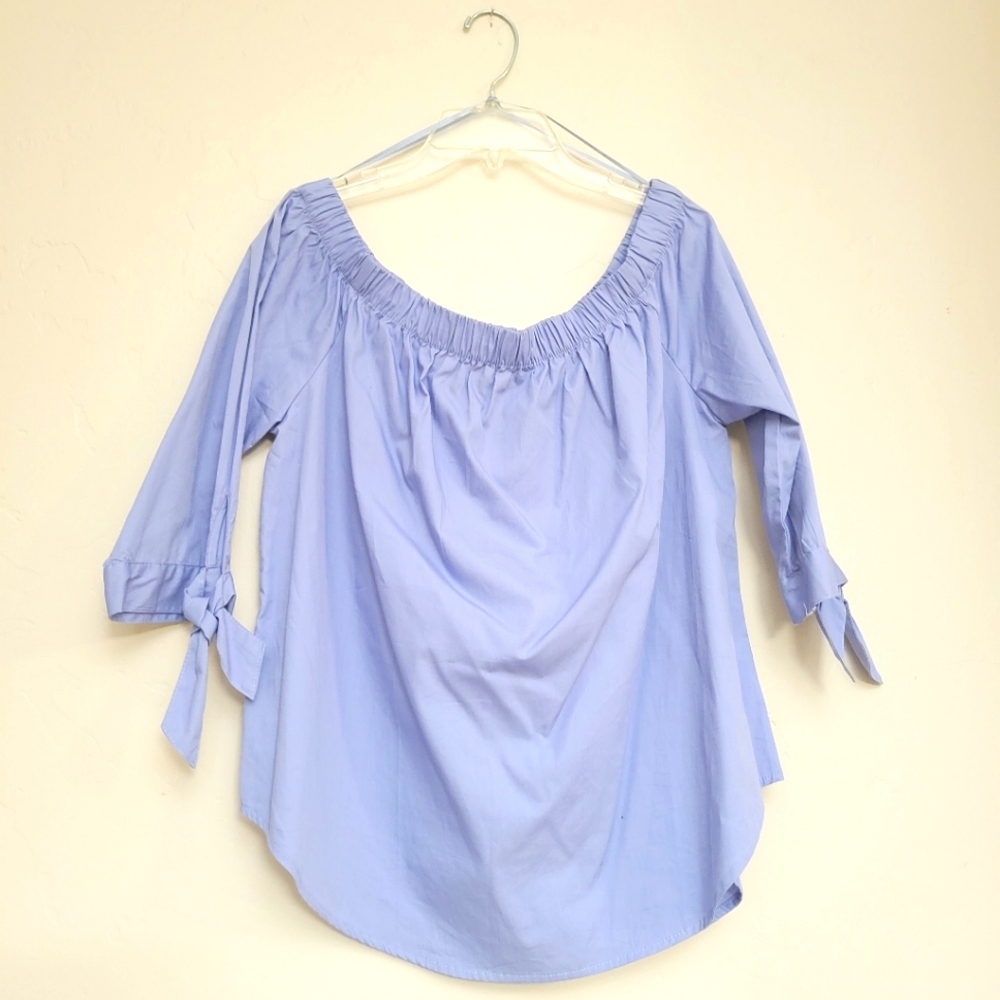 Blue women's shirt ,bow tied on sleeves